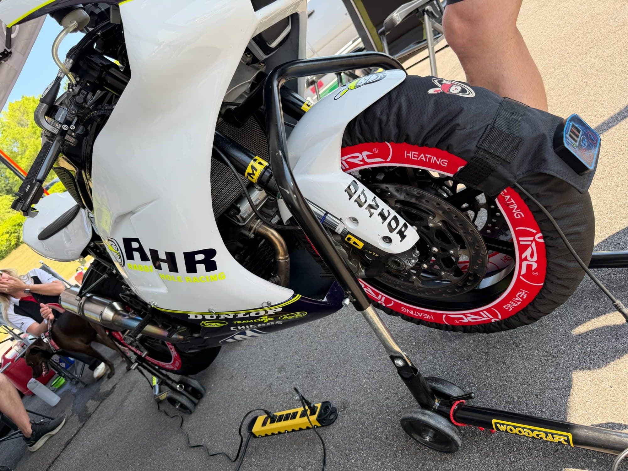 Rabbit Hole Racing bike on IRC Components tire warmers in the paddock