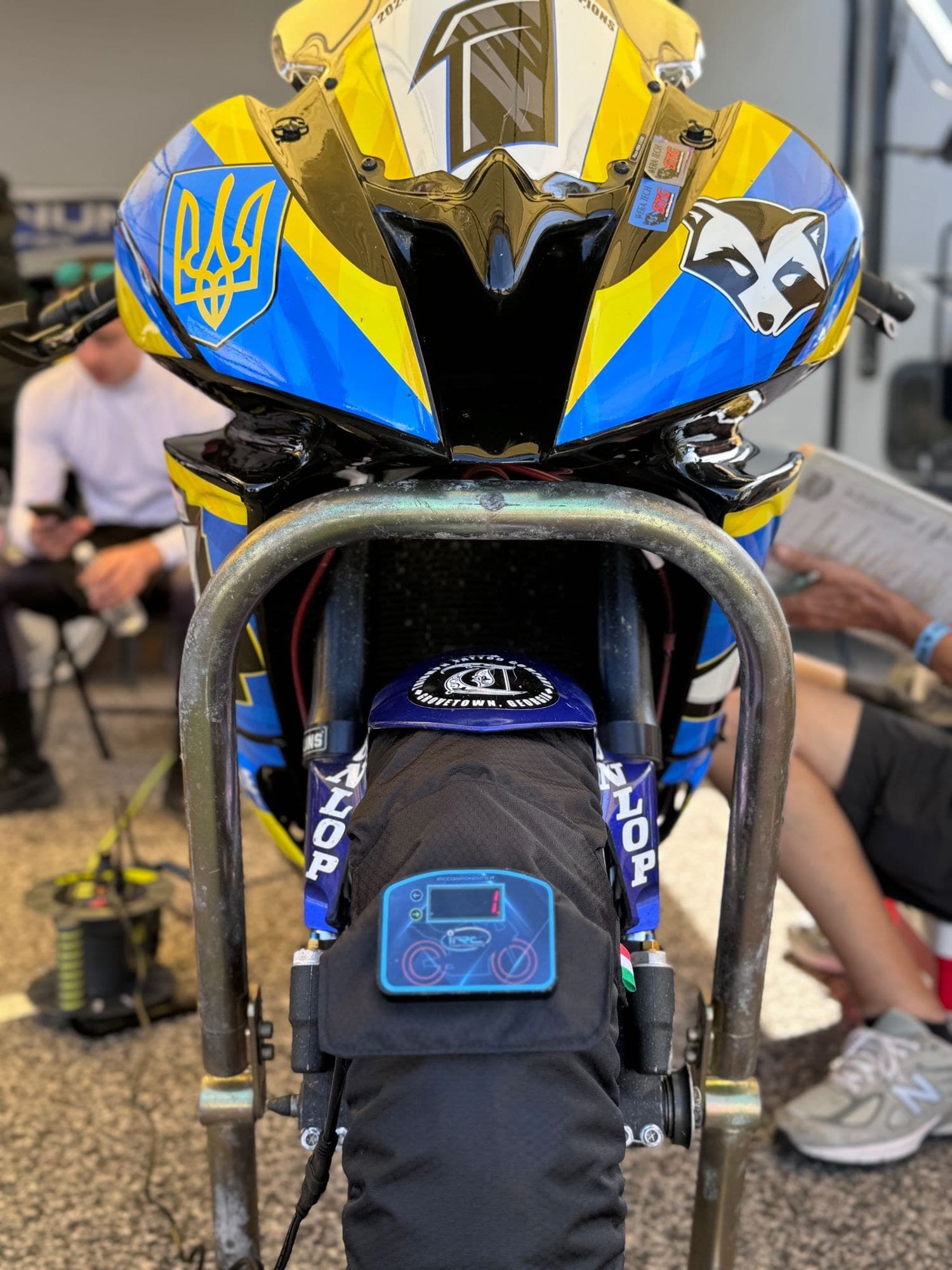 Trash Panda Racing superbike on IRC Components tire warmers in the paddock